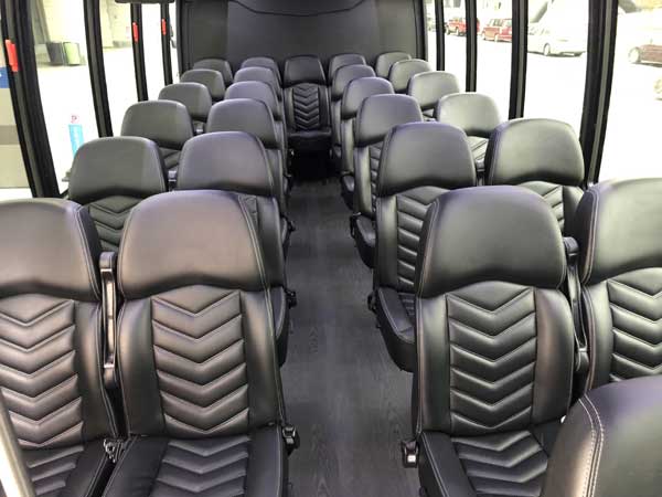 view of the seats of the mini bus taken from the front of the bus